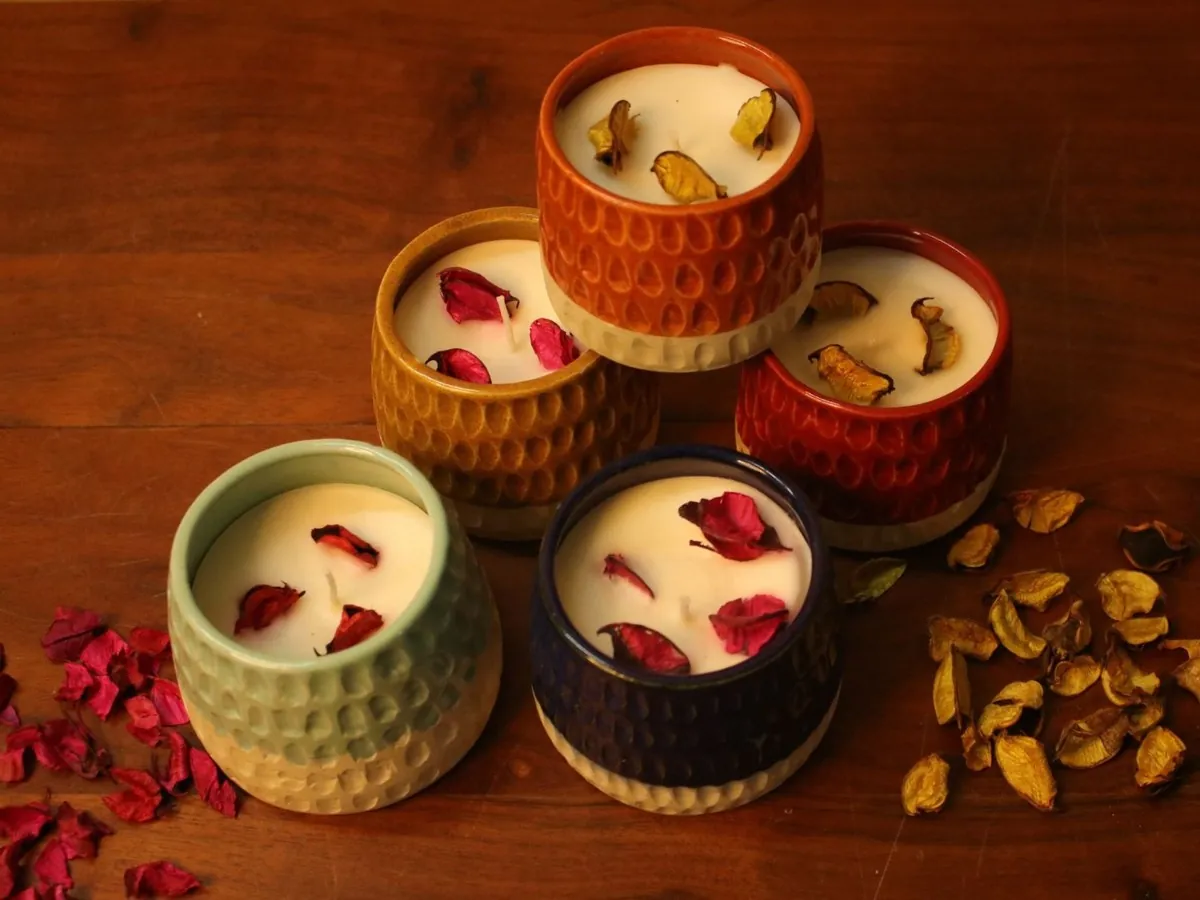 Candles set in handmade ceramic pots